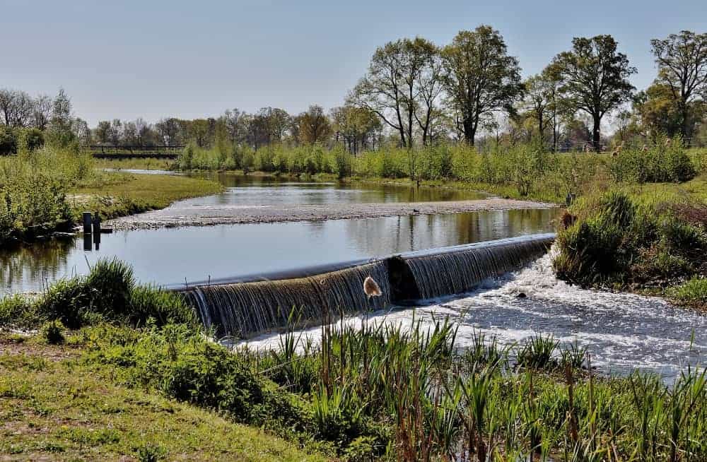 Low weir waterfall in a rural river