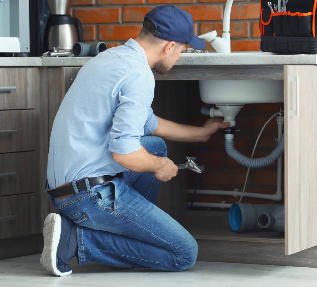 plumber fixing drain pipe